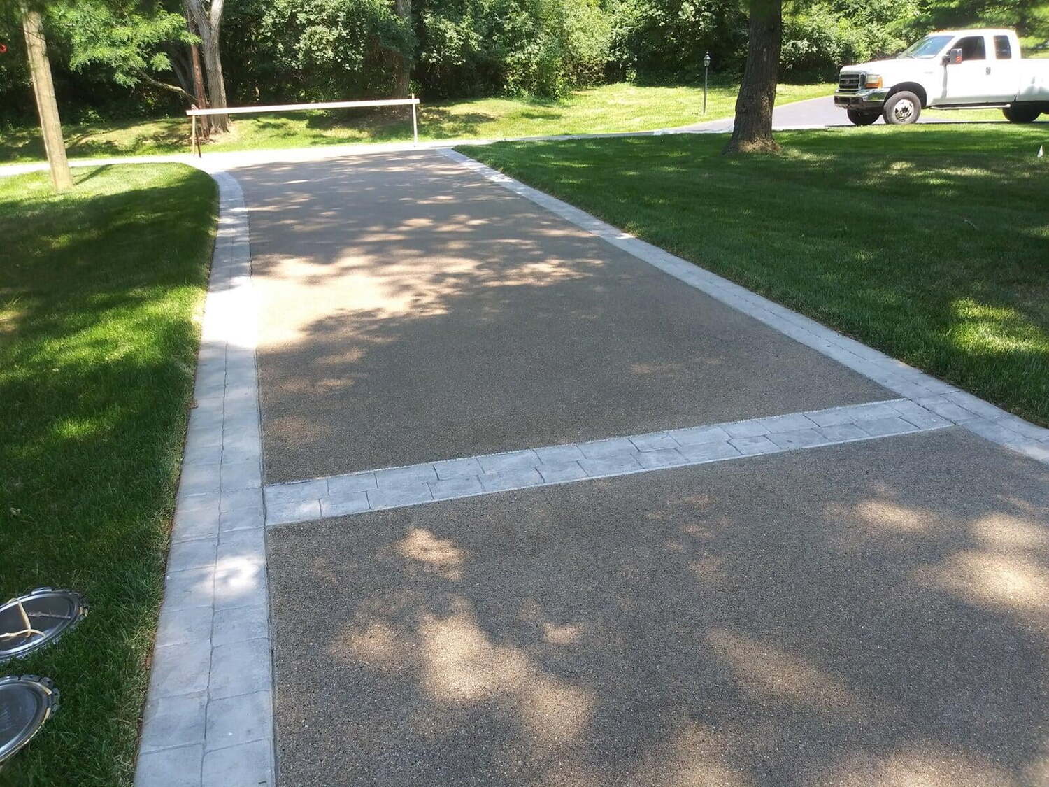 Exposed Aggregate with Stamped Cobblestone Borders Indian Hill Ohio Gentrup Concrete